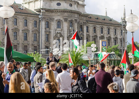 MUNICH, GERMANY - AUGUST 16, 2014: Anti-war rally in support of the Palestinian people. Protesters are asked to stop firing of Gaza Strip and the withdrawal of Israeli troops from the occupied territories. Stock Photo