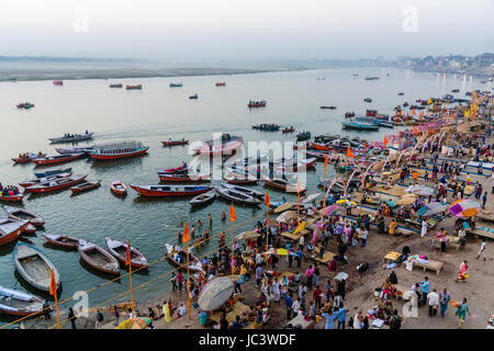 Aerial view on many colorful rowing boats, tight up at Dashashwamedh Ghat, Main Ghat, in the suburb Godowlia at the holy river Ganges Stock Photo