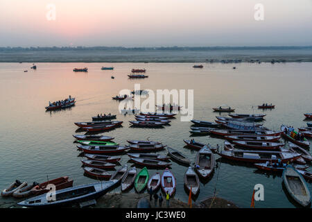 Aerial view on many colorful rowing boats, tight up at Dashashwamedh Ghat, Main Ghat, in the suburb Godowlia at the holy river Ganges Stock Photo