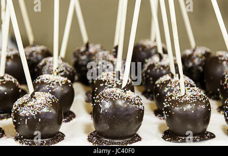 Chocolate apples, detail of a fruit covered with chocolate, dessert and diet Stock Photo