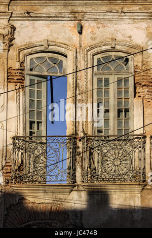 View of windows in a ruined house facade in Cachoeira, a colonial city in Bahia, Brazil Stock Photo