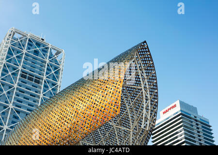 Barcelona, Spain - September 25, 2016: View of statue 'Fish' made by artist Frank Gehry, Mapfre building and Hotel Arts placed in Port Olimpic in Barc Stock Photo