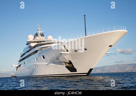 Gigantic big and large luxury mega or super motor yacht on the blue ocean. Stock Photo