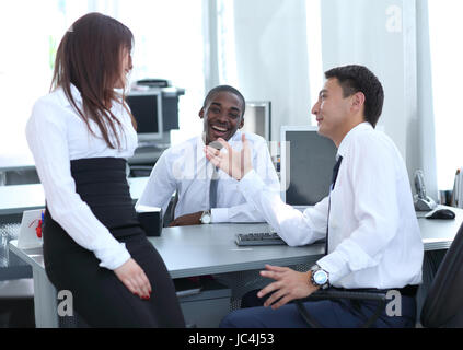 Confident  young managers working in office and smiling Stock Photo