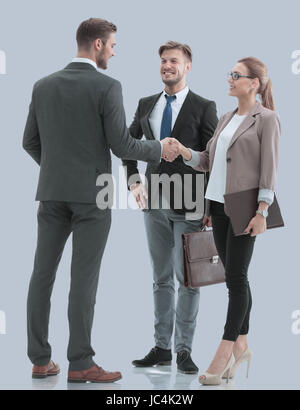 Image of business partners making handshake isolated on gray. Stock Photo