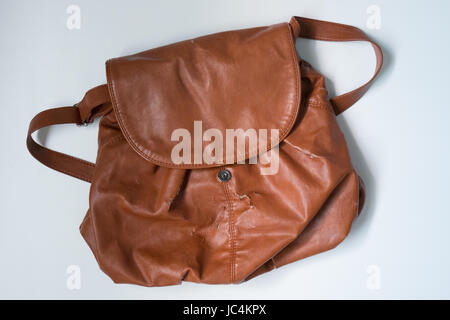 a damaged brown leather womens bag Stock Photo