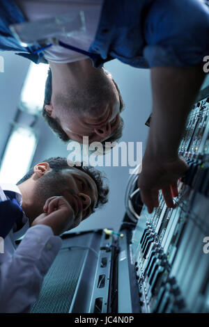 Handsome professional technicians working together Stock Photo