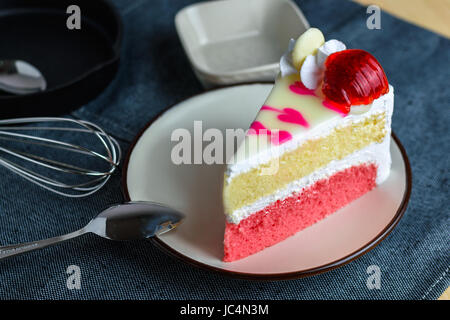 closeup delicious sweet dessert fresh strawberry decoration on slice vanilla whip cream cake ,selective focus Stock Photo