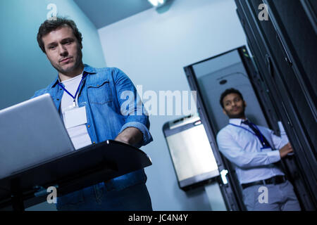 Professional male programmer working on the computer Stock Photo