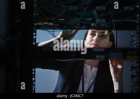Nice pleasant woman working with the communications server Stock Photo