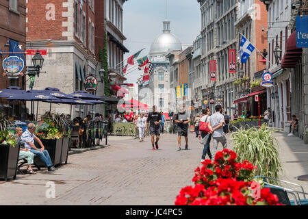 Montreal, CANADA - 12 June 2017: Tourists walking on St Paul Street and visiting Old Montreal in Summer. Stock Photo