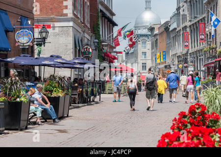 Montreal, CANADA - 12 June 2017: Tourists walking on St Paul Street and visiting Old Montreal in Summer. Stock Photo