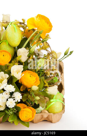 A yellow green and white floral arrangement Stock Photo
