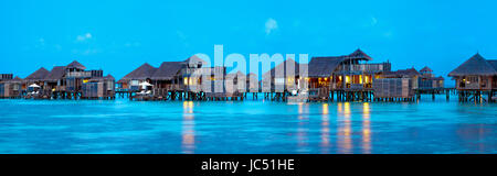 Panoramic view of evening lights in the villas at Gili Lankanfushi, Maldives. Stock Photo