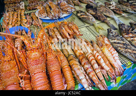 Close up of grilled lobster and other seafood sold at Asian night market Stock Photo