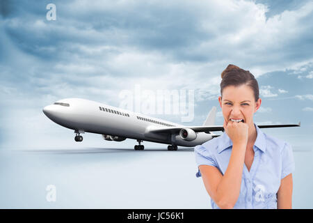Composite image of furious businesswoman looking at the camera Stock Photo