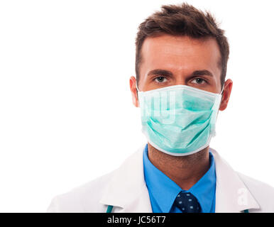 Portrait of male doctor wearing surgical mask Stock Photo