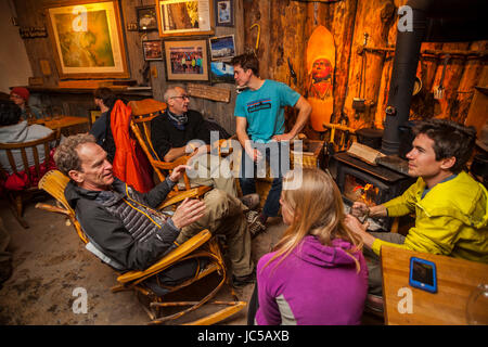 Climbers drink beer and socialize at the Ourayle House Brewery (Mr. Grumpy Pants) after a day at the Ice Park in Ouray, Colorado. Stock Photo