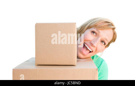 Happy Young Adult Woman Holding Moving Boxes Isolated On A White Background. Stock Photo