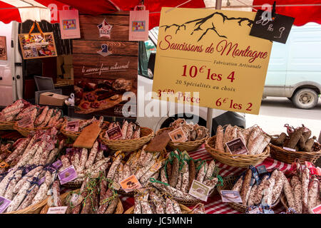 Artisanal Saucisson (dry cured sausages) stall in an outdoor market, Arles, Provence, France Stock Photo