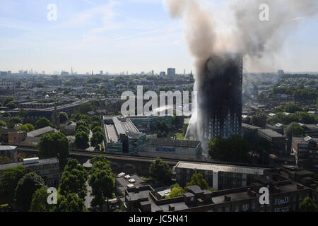 Smoke billows from a fire that has engulfed the 24-storey Grenfell Tower in west London. Stock Photo