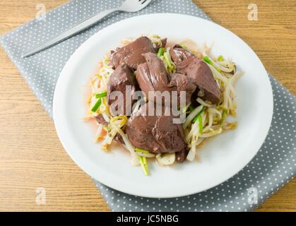 Chinese Traditional Food, A Plate of Stir Fried Bean Sprout with Congealed Pork Blood, Pork Blood Pudding or Pig Blood Curd. Stock Photo