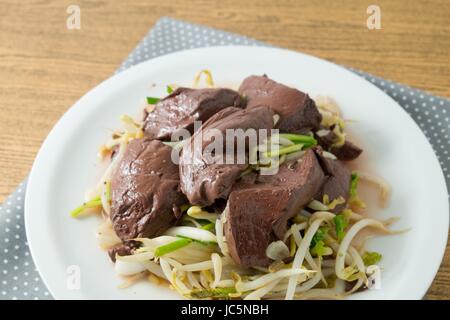 Chinese Traditional Food, A Dish of Stir Fried Bean Sprout with Congealed Pork Blood, Pork Blood Pudding or Pig Blood Curd. Stock Photo