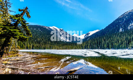 View of the still partly frozen Lower Joffre Lake in the Coast Mountains along the Duffy Lake Road, Highway 99, between Pemberton and Lillooet in BC Stock Photo