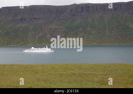MS Berlin cruise ship sailing through  narrow fjord in Iceland Stock Photo