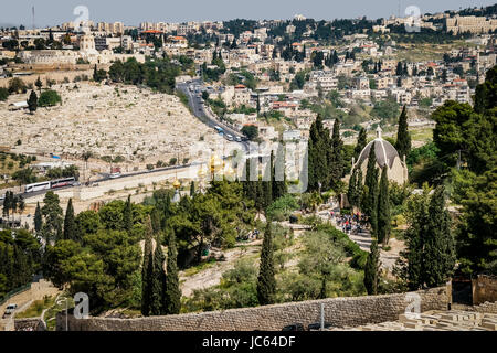 Looking over Jerusalem from the Mount of Olives. Below center are the golden onion domes of the Russian Orthodox Church of Mary Magdalene. Stock Photo