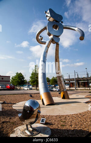 he Traveling Man, one of three stainless steel sculptures in the Deep Ellum area of Dallas, Texas Stock Photo