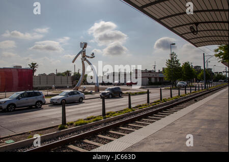 he Traveling Man, one of three stainless steel sculptures in the Deep Ellum area of Dallas, Texas Stock Photo