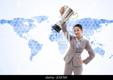 Composite image of portrait of a businesswoman showing a cup Stock Photo