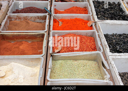 Colorful spices displayed in an informal market, China Stock Photo