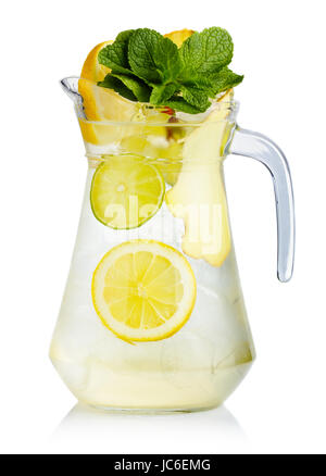 Full jug of fresh birch juice with lemon, ginger and mint leaves isolated Stock Photo