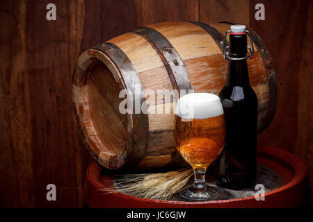 Still life with a keg of beer and draft beer by the glass. Stock Photo