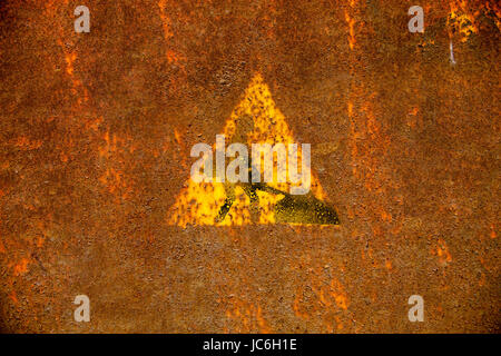 Old roadworks sign on rusty metal surface. Stock Photo