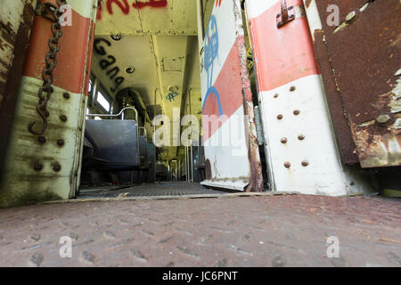 Graffiti on interior of abandoned commuter train compartment. Stock Photo