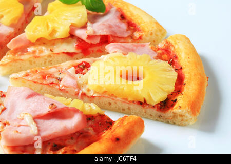 Slice of fresh baked Pizza Hawaii Stock Photo