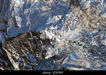 Wrinkled aluminum foil with rich and various texture. Stock Photo