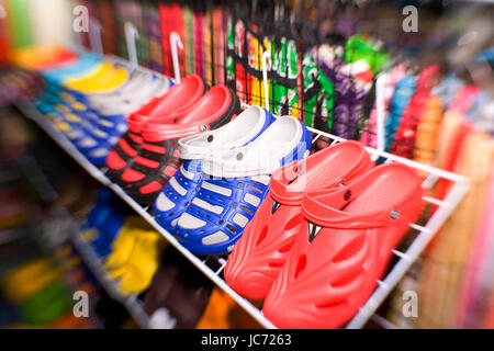 Phuket, Thailand, January 28, 2017: Colorful multi-colored shoes on the counter. Attention! On the edges of the frame there is a strong blur! Stock Photo