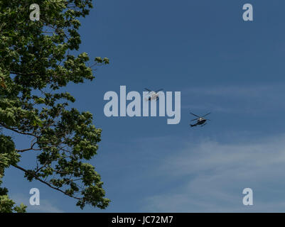 New York, NY - June 11, 2017: New York police helicopter patrolling above Governors island Stock Photo