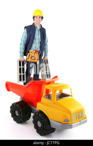 Building worker standing in plastic truck Stock Photo