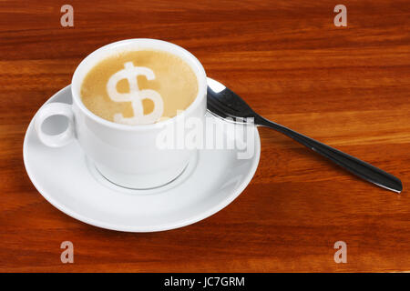 Cup of double shot cappuchino with dollar sign made with frothing milk in the coffee foam, The froth of the dollar sign is not very detailed with bubbles etc due to manipulation in creating the sign Stock Photo