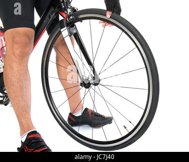 asian male cyclist checking his road bike tire Stock Photo - Alamy