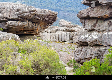 Dramatic rock formations of varying sizes and  shapes along the Wonderland track in the Grampians Ranges Stock Photo