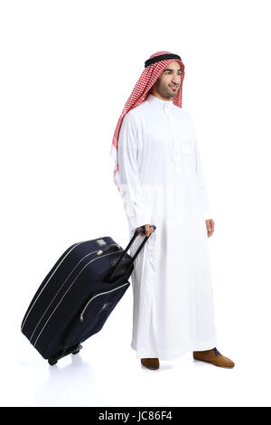 Arab traveler saudi man carrying a suitcase isolated on a white background Stock Photo