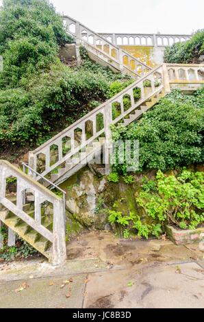 The Alcatraz Penitentiary island, now a museum, in San Francisco, California, USA. A view of an old, moldy, stone staircase leading to the Cellhouse on the historic federal prison. Stock Photo