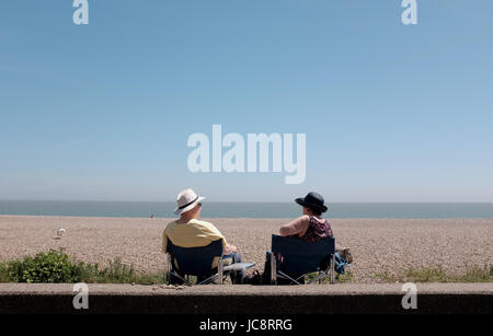 Aldeburgh Suffolk, UK. 14th June, 2017. Visitors enjoy the hot sunny weather on Aldeburgh beach along the Suffolk coast today . The hot sunny weather is forecast to spread across Britain again in the next few days with temperatures reaching as high as 28 degrees in some parts Credit: Simon Dack/Alamy Live News Stock Photo