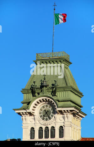 Clock tower of Palazzo del Comune on Piazza Unita d'Italia in Trieste, Italy. Trieste is the capital of the autonomous region Friuli-Venezia Giulia Stock Photo